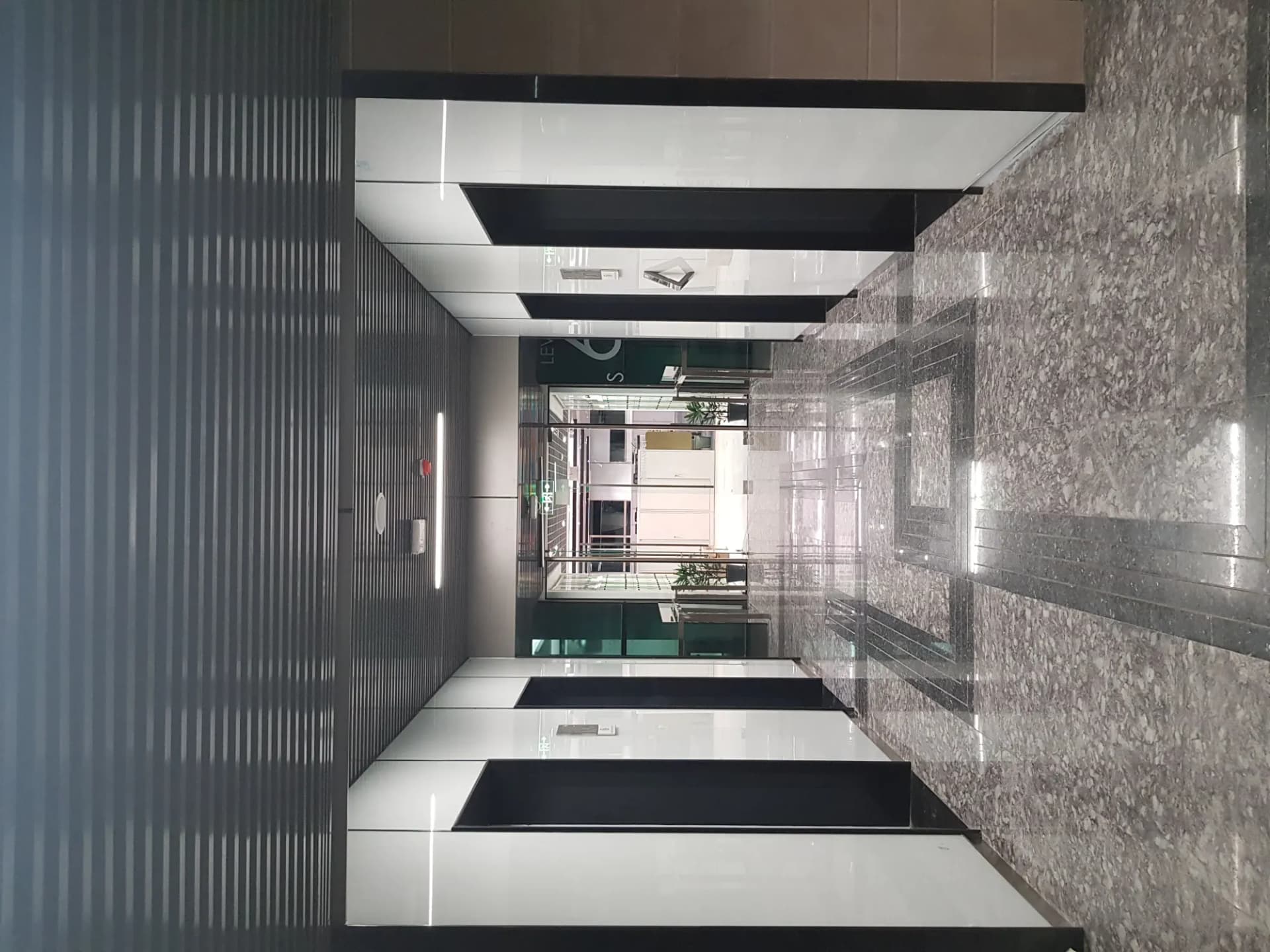 Glass lift lobby and stairwell at The Hive Islamabad