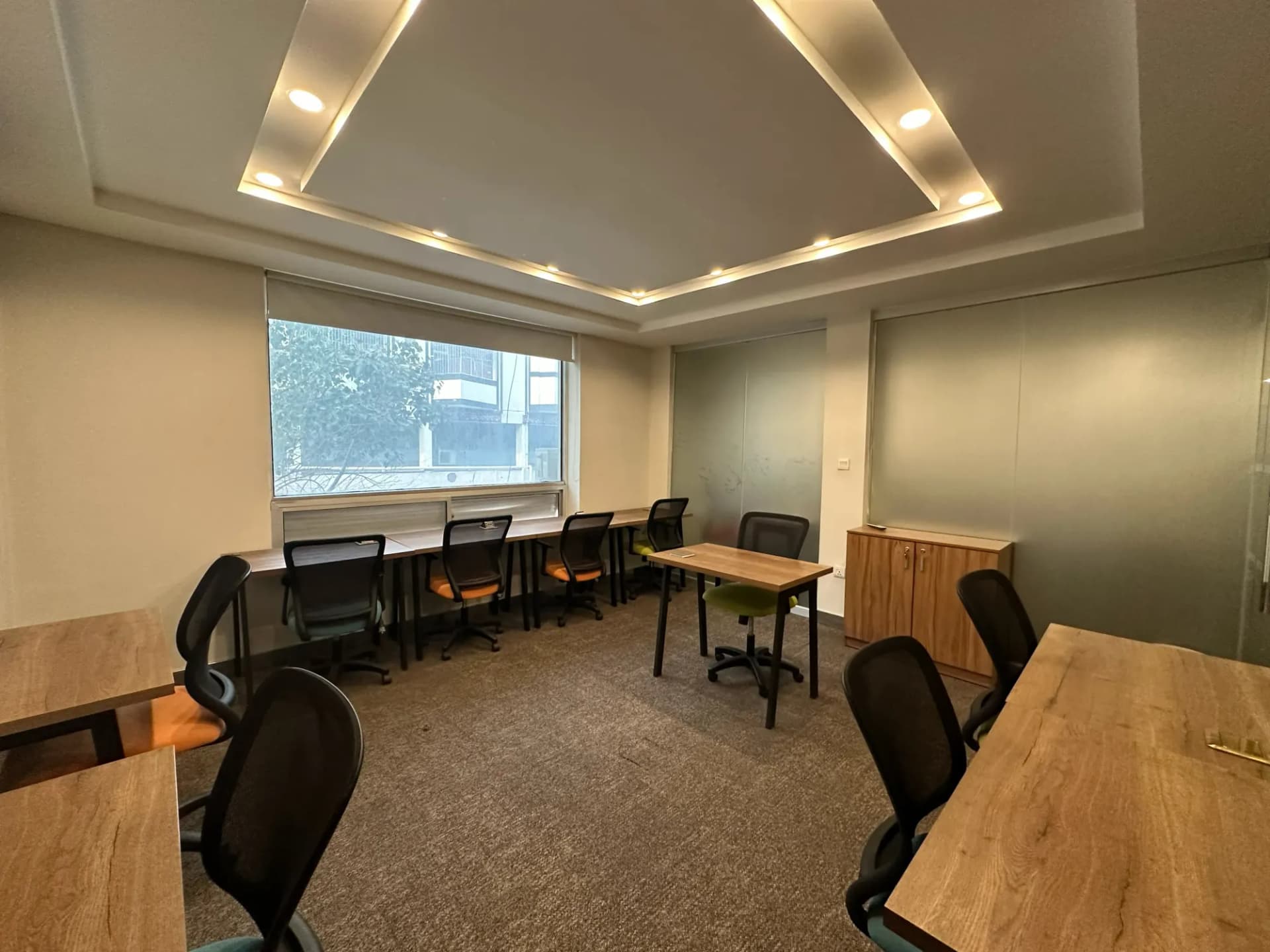 Private office at The Hive Islamabad with desks along a window