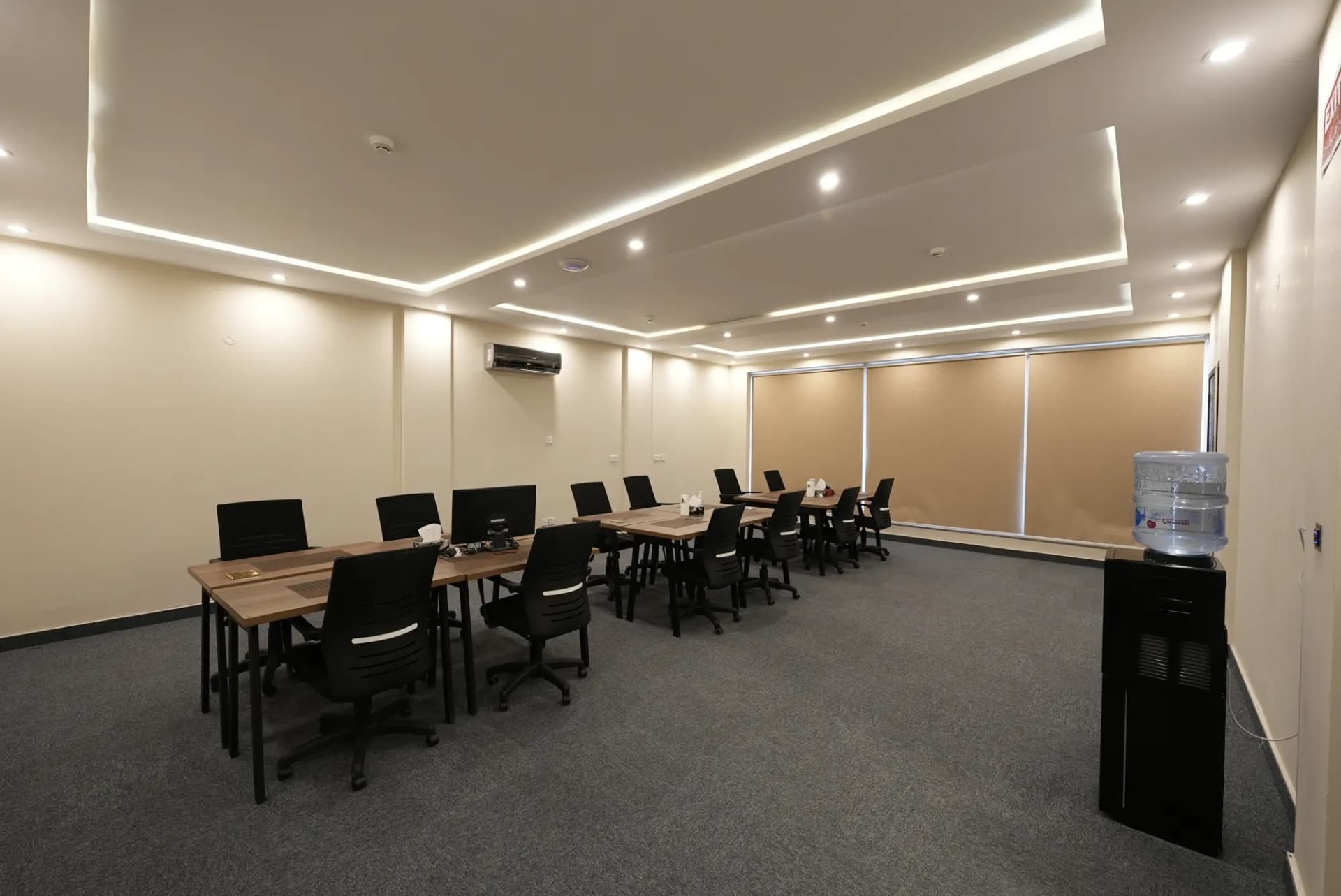 Training room at The Hive Lahore set with rows of desks and chairs
